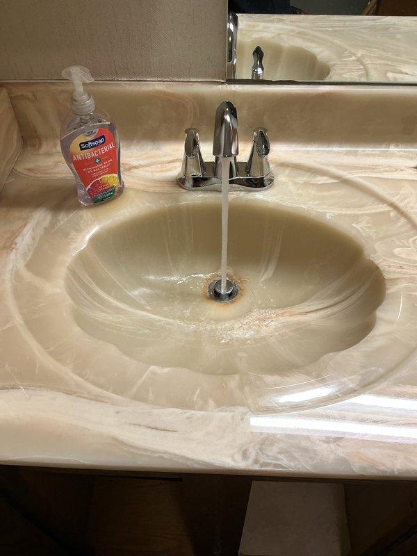 Replaced two second-floor laboratory faucets with new Moen Eva single-handle fixtures, installed new shut-off valves for both sinks, and replaced the trap assembly on the left sink. All fixtures were tested for proper operation and verified leak-free upon completion.