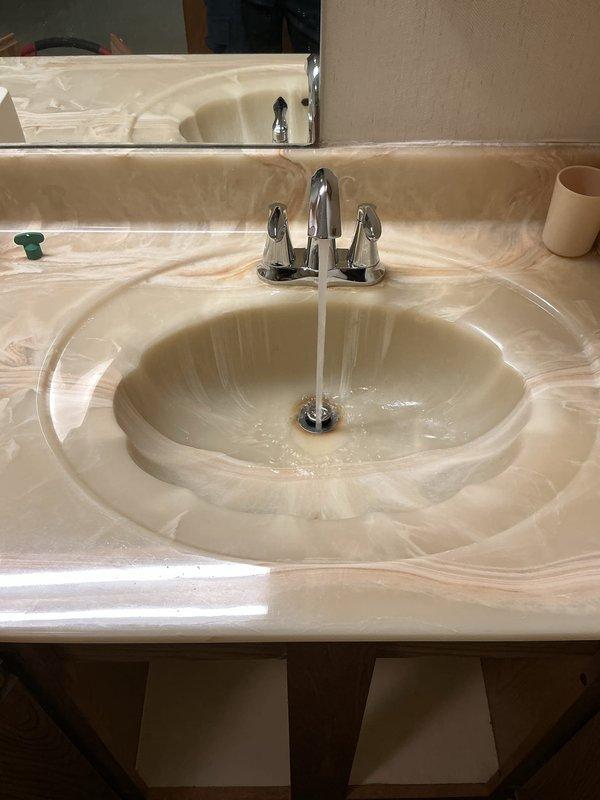 Replaced two second-floor laboratory faucets with new Moen Eva single-handle fixtures, installed new shut-off valves for both sinks, and replaced the trap assembly on the left sink. All fixtures were tested for proper operation and verified leak-free upon completion.