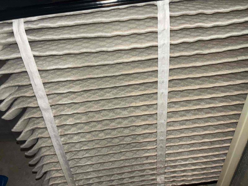 Completed routine MVP cooling maintenance on 11-year-old air conditioning system. Inspected electrical disconnect box and verified proper operation of pull-out switch and fuse indicators. Examined air filter and documented moderate dust accumulation on pleated media. All system components found operational during preventive maintenance visit.