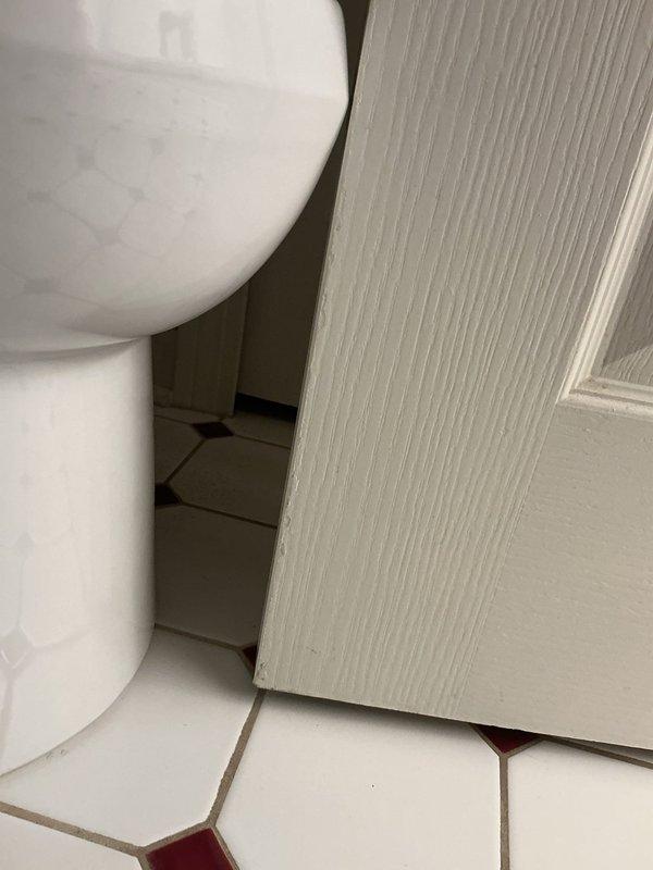 Responded to callback following recent toilet installation where bathroom door clearance was compromised. Upon arrival, assessed the toilet positioning in relation to door swing path and identified interference issue. Adjusted toilet placement to ensure proper clearance for full door operation while maintaining correct flange alignment and seal integrity. Verified door now closes completely without obstruction and confirmed toilet remains securely mounted with no leaks at base or supply connection.