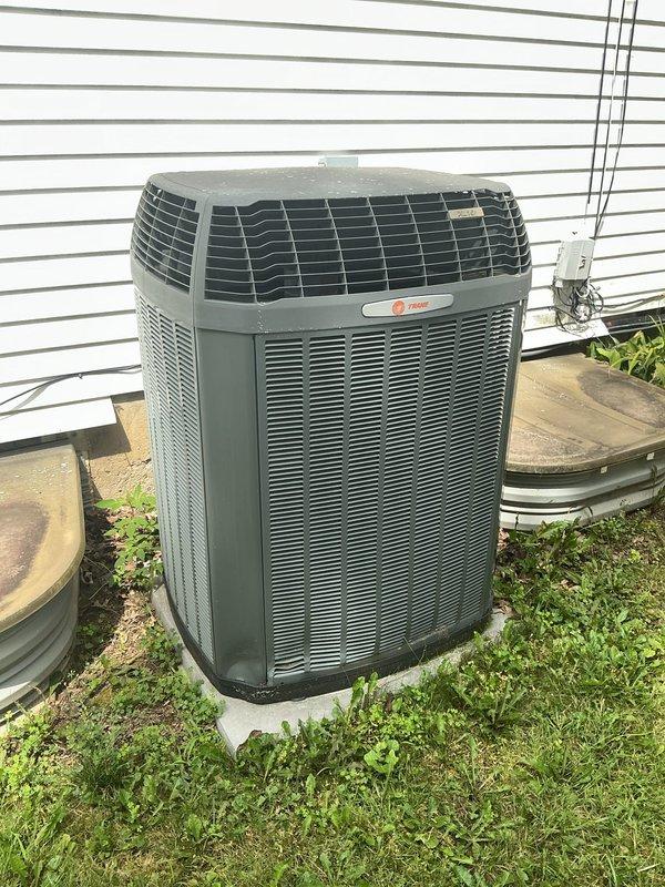 Responded to water leak complaint with pooling under furnace. Upon arrival, found approximately 1/2 gallon of water accumulating 2-3 times daily despite homeowner shutting off water supply to Aprilaire humidifier. Inspected 16-year-old Trane system including outdoor condensing unit, electrical connections, and indoor components. Extracted standing water with wet/dry vacuum and traced leak source beyond humidifier supply line. Identified persistent water accumulation requiring further diagnosis of condensate drain system or secondary leak point in HVAC equipment.