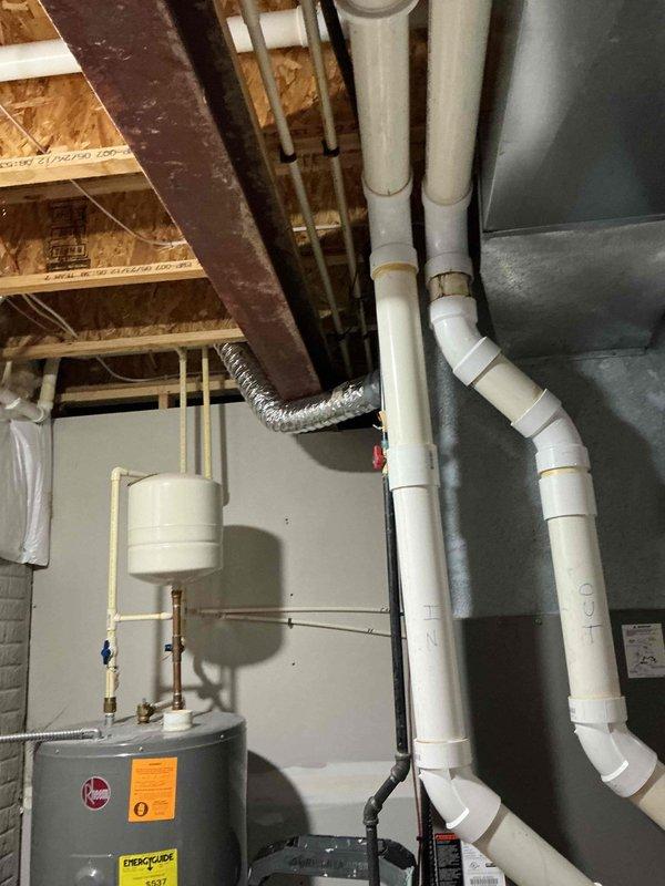 Conducted on-site evaluation for whole home generator installation. Assessed basement utility area to determine electrical service capacity, available space for transfer switch installation, and proper routing for electrical conduit from main service panel. Evaluated attic space to identify optimal location for generator connection and reviewed existing electrical infrastructure. Documented current water heater, plumbing, and HVAC configurations to ensure proper clearances and code compliance for generator placement. Photographed electrical panel access points and structural considerations for load calculation and equipment sizing recommendations.