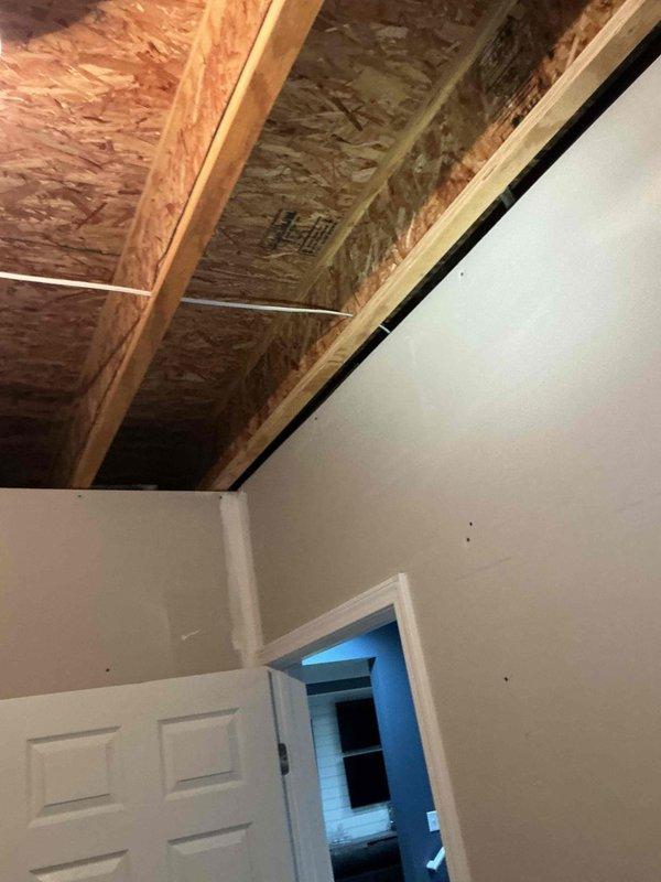 Conducted on-site evaluation for whole home generator installation. Assessed basement utility area to determine electrical service capacity, available space for transfer switch installation, and proper routing for electrical conduit from main service panel. Evaluated attic space to identify optimal location for generator connection and reviewed existing electrical infrastructure. Documented current water heater, plumbing, and HVAC configurations to ensure proper clearances and code compliance for generator placement. Photographed electrical panel access points and structural considerations for load calculation and equipment sizing recommendations.