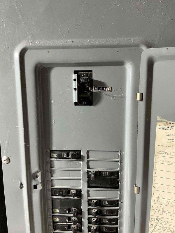 Completed comprehensive electrical assessment for standby generator installation at 50-year-old residential property with no existing backup power system. Evaluated current Square D load center and main electrical service panel to determine capacity and compatibility requirements for generator integration. Documented existing circuit breaker configuration, main breaker specifications, and available panel capacity through photographic inspection. Provided detailed estimate and quotation for complete standby generator installation including necessary electrical connections, transfer switch integration, and code-compliant wiring modifications required to accommodate new backup power system.