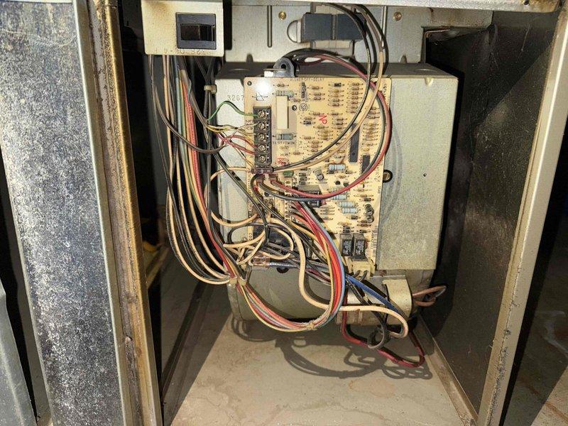 Completed MVP recurring cooling maintenance visit on residential HVAC system. Performed comprehensive inspection of furnace unit and cooling components, including examination of control board, electrical connections, and ductwork. Documented system condition through interior cabinet inspection showing control board with relays, capacitors, and wiring connections, as well as overall unit installation in basement mechanical room. All components operational and system functioning within normal parameters.