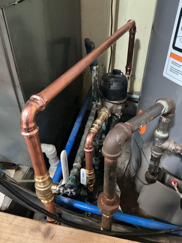 Completed comprehensive plumbing upgrade including installation of new main water valve with meter spuds, customer-supplied shower valve, lavatory faucet, and laundry faucet, along with new outdoor sillcock. All installations were performed to code specifications with proper sealing and connections, utilizing pre-ordered parts and customer-prepared drywall access points coordinated with municipal water shutoff.
