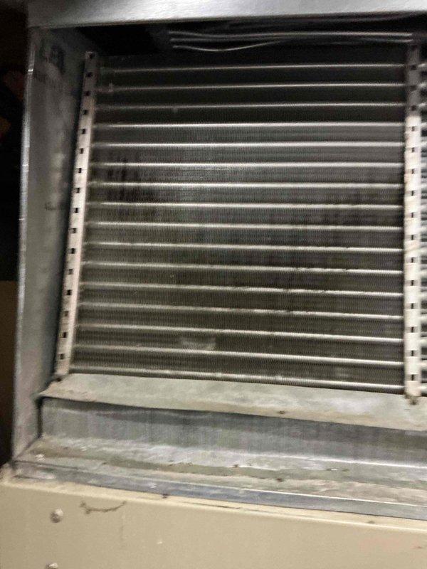 Completed preventive maintenance service on a 6-year-old residential air conditioning system. Performed comprehensive inspection of outdoor condensing unit and indoor evaporator coil, verifying all components were operating within normal parameters. System showed typical dust accumulation in drainage pan but no mechanical issues or refrigerant concerns were identified during the tune-up procedure.