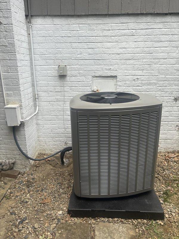Completed full HVAC system installation including an 80% efficiency Amana furnace and matching air conditioning unit. The furnace was installed in the basement mechanical room with proper ductwork connections, plenum assembly, and filtration system. All warning labels and specification plates were properly affixed to equipment surfaces per manufacturer requirements. The outdoor condensing unit was positioned on a vibration-dampening rubber pad against the exterior wall with appropriate clearances. Electrical conduit and disconnects were installed to code, with weatherproof junction boxes mounted for exterior connections. Copper refrigerant lines were run between the indoor and outdoor units. System was tested, charged to specifications, and verified operational.