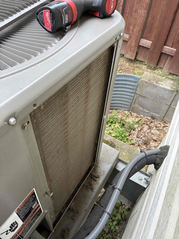 Completed MVP cooling maintenance visit on 6-year-old residential air conditioning system. Performed comprehensive inspection of outdoor condenser unit, including removal of side access panel to evaluate internal components. Condenser coils exhibited moderate to heavy accumulation of dirt, dust, and debris between fins, which can restrict airflow and reduce system efficiency. Assessed overall unit condition and documented findings with photographs for service records. Unit operational at time of service. Routine preventive maintenance performed per MVP service agreement specifications.