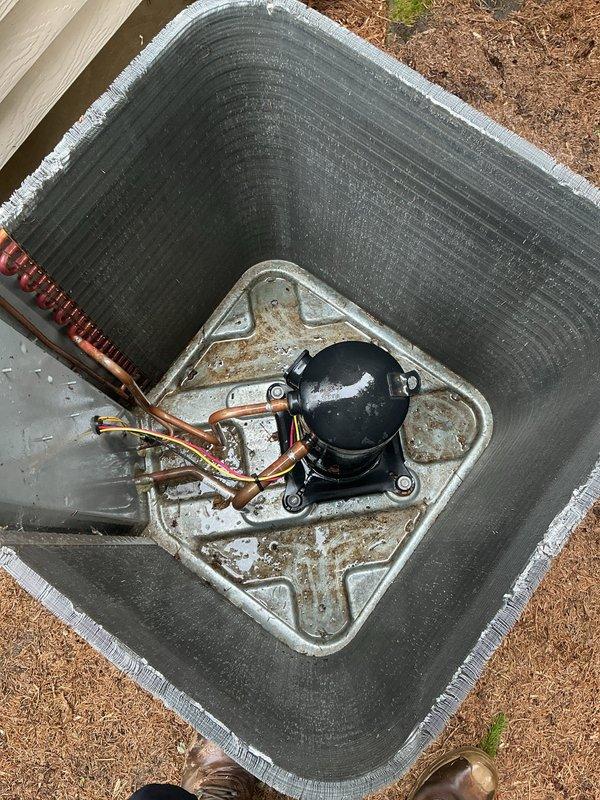 Completed annual cooling maintenance on a 5-year-old Lennox air conditioning system. Performed comprehensive AC tune-up including inspection of the outdoor condensing unit, verified proper operation of compressor and condenser coil, checked refrigerant lines and electrical connections, and confirmed system is functioning properly. Unit showed normal weathering with some rust staining on base plate but overall operational condition is satisfactory.