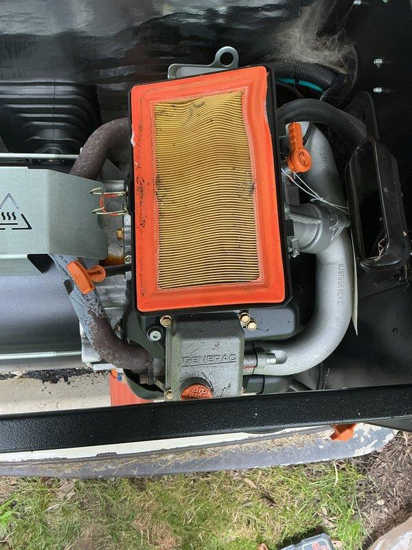 Responded to service call for Generac generator that failed to start during power outage with red indicator light illuminated. Upon arrival, performed diagnostic inspection of generator system including examination of engine compartment, air filter assembly, and electrical components. Found air filter heavily contaminated with dirt and debris, restricting airflow to engine. Cleaned and inspected engine components, checked fuel system, and verified proper operation of automatic transfer switch. Tested generator start sequence and confirmed unit now starts properly and transfers load as designed. System returned to full operational status.