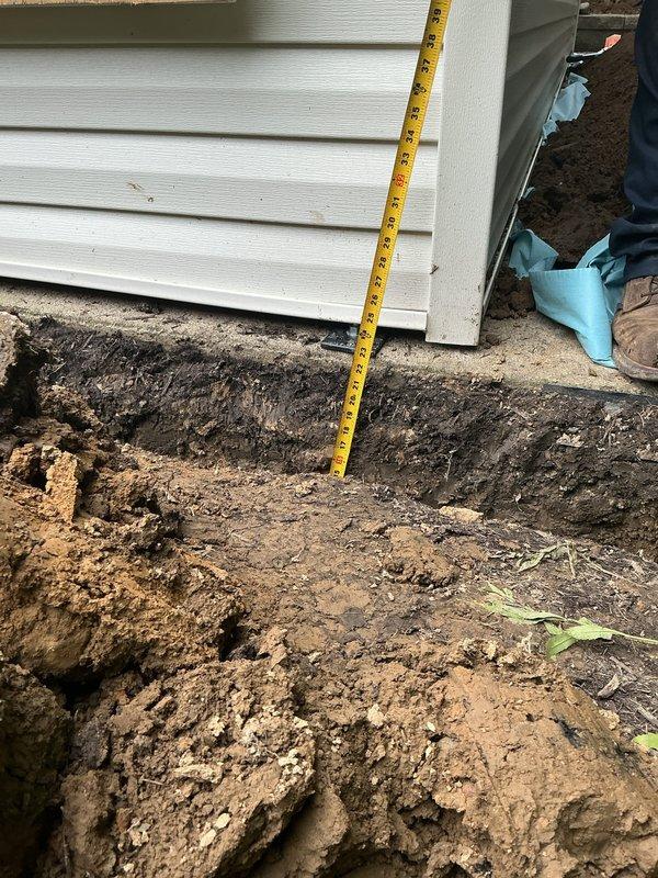 Installed new 20A 110V electrical circuit from main panel to detached barn at rear of property. Routed 12-2 wiring approximately 50 feet through finished basement utilizing existing HVAC chase spaces, installing access panels where necessary and surface-mounted wiremold conduit to navigate obstructions. Circuit exits through side of home and continues via 50-foot exterior trench through landscaped areas to front entrance of barn structure. Interior barn installation includes three 110V receptacles and two lighting fixtures controlled by 3-way switch configuration at dual entry points. All wiring installed to code specifications with proper depth trenching and protection.