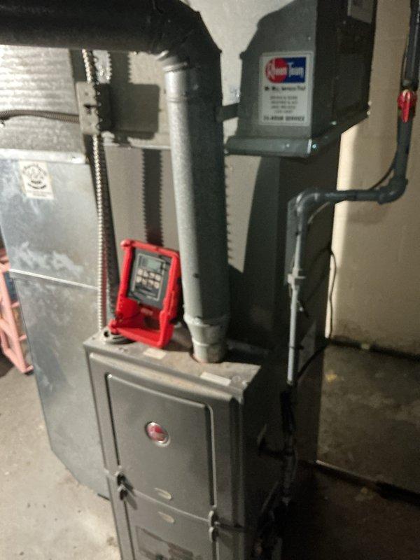 Completed second-phase HVAC installation including air conditioning unit and evaporator coil integration with existing furnace system. Connected ductwork assembly to air handler plenum, secured all joints with metal banding, and installed electrical conduit and wiring to control panel. Performed system diagnostics and verified proper airflow through insulated duct runs.
