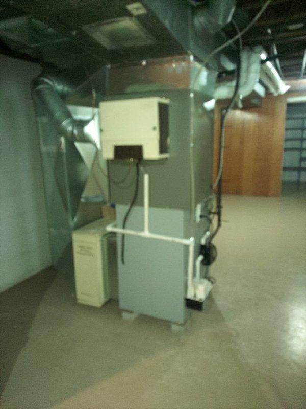 Completed second air conditioning installation with evaporator coil replacement in residential basement location. System was charged with R454B refrigerant to manufacturer specifications, with final operating pressures reading 110.5 psi and temperatures stabilized at 41.7°F suction and 87.5°F liquid line. Used Testo 550 digital manifold gauge set to verify proper refrigerant charge and system performance. All ductwork connections were secured to the furnace cabinet, and the complete HVAC system was tested for proper operation and airflow distribution.