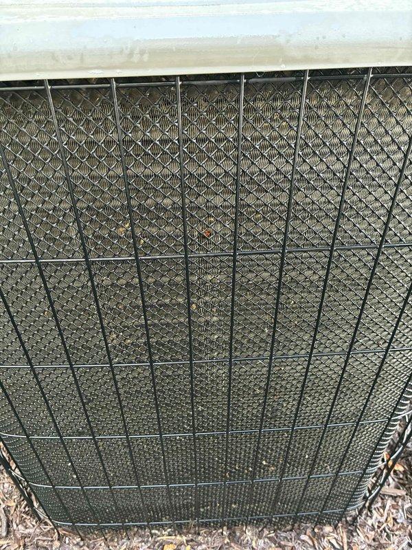 Completed scheduled MVP cooling maintenance visit on outdoor condenser unit. Performed comprehensive system inspection including visual assessment of condenser coil, which showed significant dirt and debris accumulation on protective mesh screening affecting airflow efficiency. Opened electrical panel and inspected all internal components including dual capacitors, wiring connections, and terminal points. All electrical connections found secure with proper wire routing. Verified capacitor mounting and electrical component integrity. Unit operational at time of service.