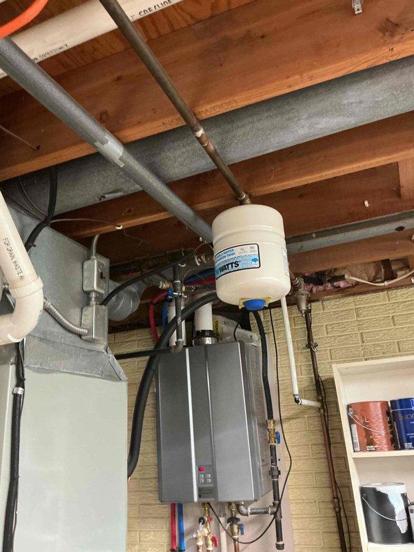 Completed routine air conditioning tune-up and maintenance on existing system with no reported issues or concerns. Unit was found operating within normal parameters during inspection. Documented system condition with photos showing significant frost buildup on evaporator coil, indicating possible airflow restriction or refrigerant charge concern requiring future monitoring.