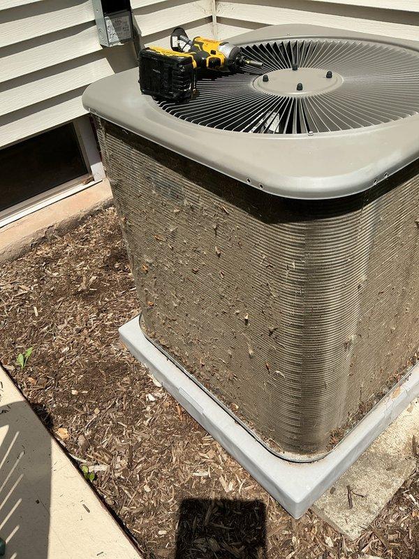 Completed MVP cooling maintenance visit on residential air conditioning system. Performed comprehensive inspection of outdoor condenser unit, verified proper operation of fan assembly, and documented equipment condition with photos showing unit in good operational status with intact housing and components.