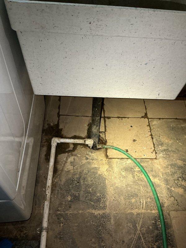 Responded to laundry area drain backup and slow drainage issue in 1969-built home. Located main drain cleanout access point in utility area and deployed mechanical cable auger to clear blockage in main drain line. Successfully removed obstruction and restored proper drainage flow to laundry area drain system. Tested drainage performance and confirmed full functionality upon completion.