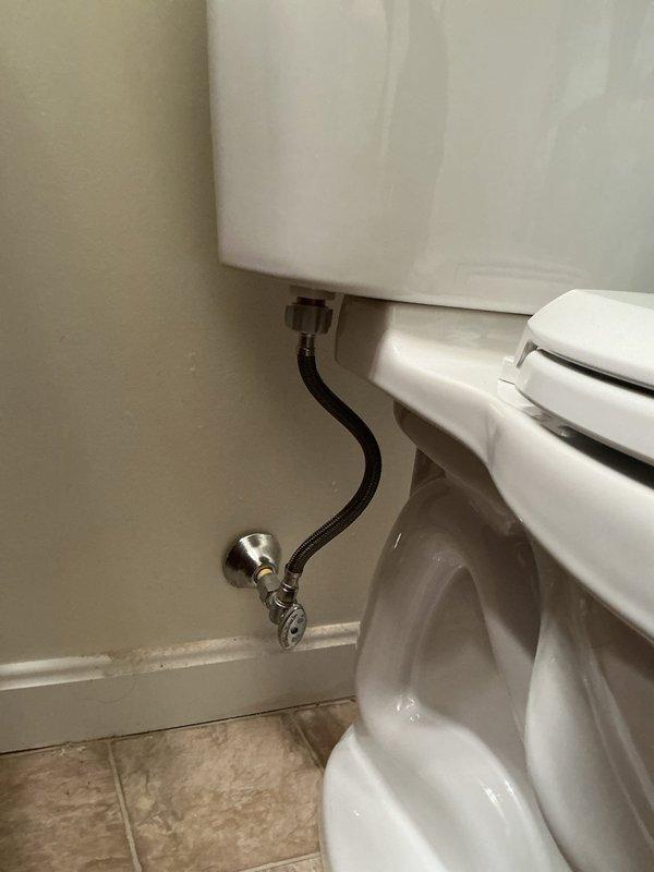 Replaced existing toilet in basement bathroom with new American Standard Champion chair height elongated model. Removed old fixture, installed new toilet with proper sealing and mounting, and connected water supply line using braided stainless steel flex line to existing angle stop valve. Verified proper operation, checked for leaks, and ensured secure installation on tile flooring.