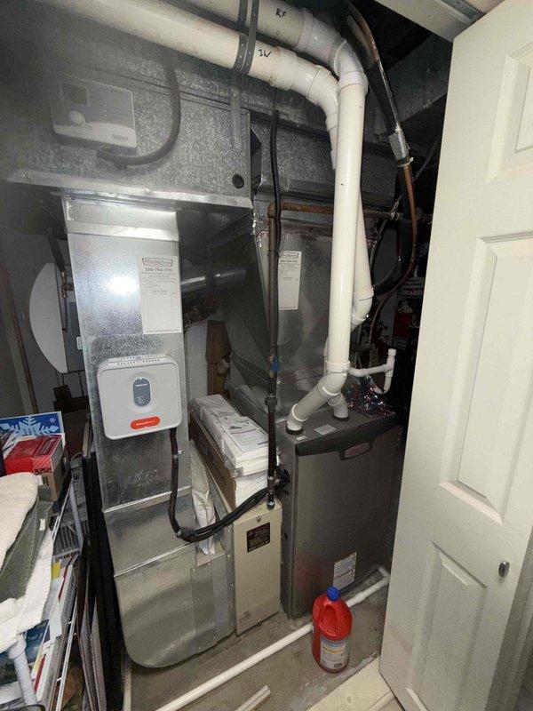 Completed scheduled MVP cooling maintenance visit on 4-year-old residential HVAC system. Performed comprehensive system inspection including visual assessment of furnace unit, ductwork connections, and white PVC piping configuration in utility closet installation. Conducted electrical diagnostics using Fieldpiece meter to verify capacitor performance and check voltage readings across all system components. Verified proper operation of all electrical connections and wiring harnesses. Inspected control box, humidifier unit, and air distribution ductwork for proper function. System operating within normal parameters with no deficiencies noted at time of service.