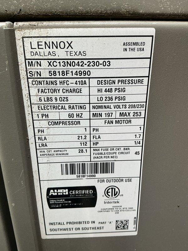 Completed MVP recurring cooling maintenance visit on 8-year-old Lennox XC13N042-230-03 outdoor condensing unit. Performed comprehensive system inspection, verified unit operation, and documented equipment specifications including HFC-410A refrigerant charge, electrical parameters at 208/230V single-phase, and compressor RLA of 21.2 amps. Unit found in satisfactory operating condition with proper airflow through condenser coil and adequate clearance from surrounding landscaping and structure.