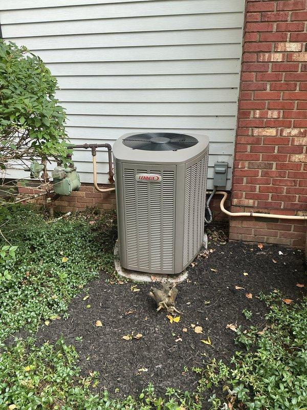 Completed MVP recurring cooling maintenance visit on 8-year-old Lennox XC13N042-230-03 outdoor condensing unit. Performed comprehensive system inspection, verified unit operation, and documented equipment specifications including HFC-410A refrigerant charge, electrical parameters at 208/230V single-phase, and compressor RLA of 21.2 amps. Unit found in satisfactory operating condition with proper airflow through condenser coil and adequate clearance from surrounding landscaping and structure.