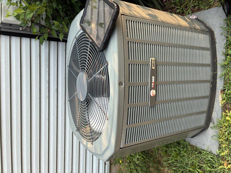 Completed routine maintenance visit on 14-year-old residential air conditioning system. Performed comprehensive inspection of outdoor condenser unit, verified proper operation of fan motor and compressor, and examined electrical components including capacitor and wiring connections. Unit found to be operating within normal parameters despite age-related wear and debris accumulation typical of outdoor installations.