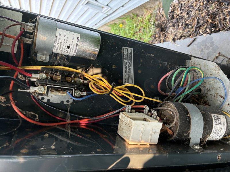 Completed routine maintenance visit on 14-year-old residential air conditioning system. Performed comprehensive inspection of outdoor condenser unit, verified proper operation of fan motor and compressor, and examined electrical components including capacitor and wiring connections. Unit found to be operating within normal parameters despite age-related wear and debris accumulation typical of outdoor installations.