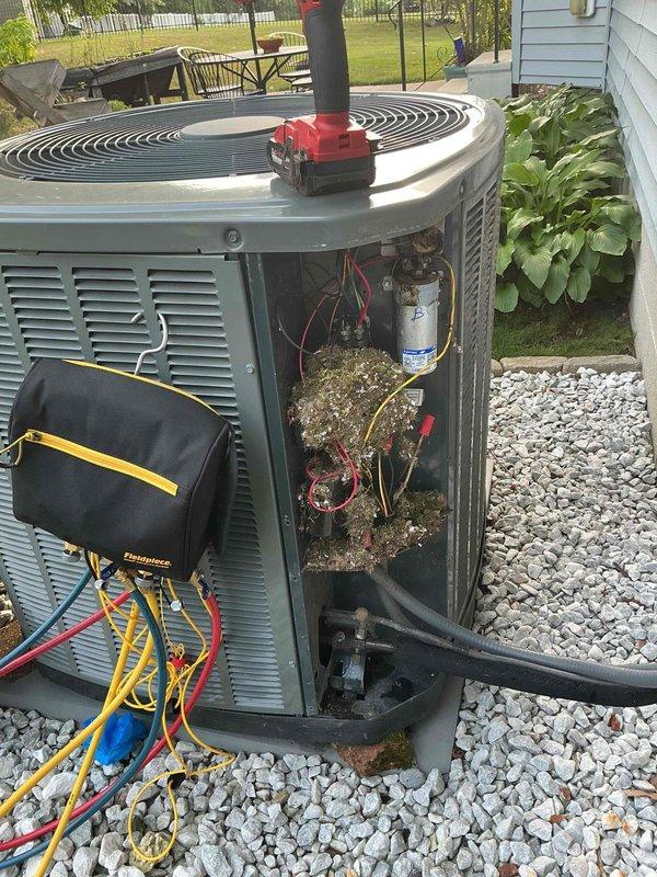 Completed MVP cooling maintenance visit on 13-year-old system. Upon inspection, found significant rust and corrosion on capacitor terminals and housing, along with debris accumulation in electrical compartment. Performed system diagnostics using test equipment to verify operational parameters. Cleaned internal components, removed debris and organic material from access panel area. Checked electrical connections, refrigerant lines, and contactor operation. System tested and confirmed operational despite age-related wear on components.