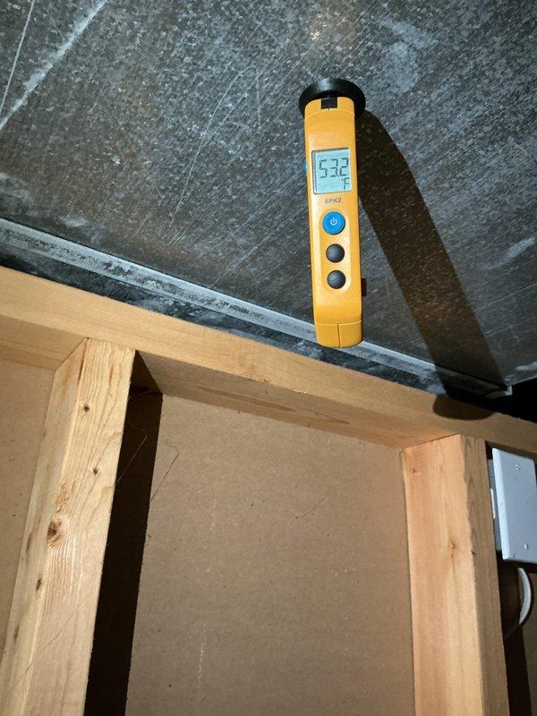 Completed preventive maintenance on 2-year-old air conditioning system. Performed temperature diagnostics at supply and return air locations, recording 53.2°F at supply plenum and 70°F at return air, indicating proper system operation and adequate temperature split. Inspected Aprilaire humidifier component and air handler unit, confirmed all equipment operating within normal parameters.