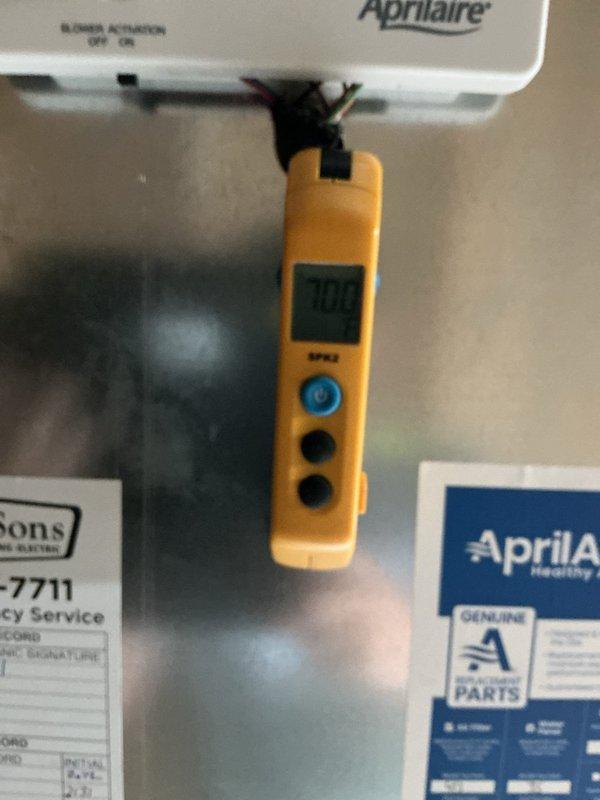 Completed preventive maintenance on 2-year-old air conditioning system. Performed temperature diagnostics at supply and return air locations, recording 53.2°F at supply plenum and 70°F at return air, indicating proper system operation and adequate temperature split. Inspected Aprilaire humidifier component and air handler unit, confirmed all equipment operating within normal parameters.