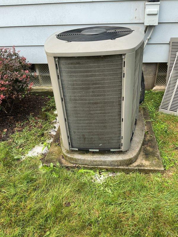 # HVAC Maintenance - Cooling

Performed comprehensive annual preventive maintenance on residential central air conditioning system approximately 3-4 years old. Conducted visual inspection of outdoor condensing unit, noting normal weathering and environmental exposure on cabinet and coil surfaces with accumulated dirt and grime on condenser fins. Removed access panel to inspect internal electrical components including capacitor, contactor assembly, and wiring connections. Verified all electrical connections were secure with no signs of overheating or deterioration. Checked capacitor condition and mounting. Inspected fan motor and compressor for proper operation. Noted drainage line routing and foundation clearance were appropriate.

Exterior condenser coil showed moderate dirt accumulation affecting heat transfer efficiency. Unit positioned on stable concrete pad with adequate clearance from structure. Electrical disconnect box and conduit connections verified secure. Foundation ventila