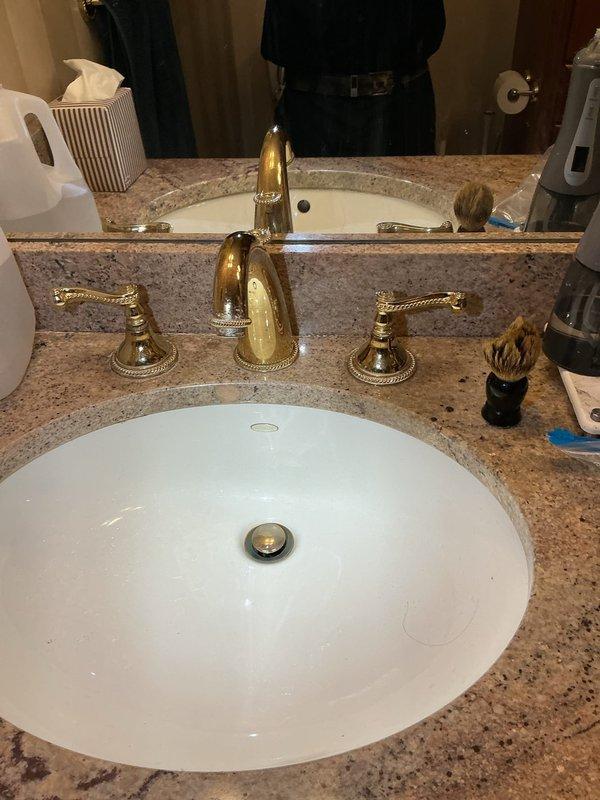 Completed installation of two bathroom sink faucets with customer-supplied hardware after homeowner encountered corroded plumbing during DIY attempt. Addressed underlying corrosion issues, secured proper connections to existing supply lines, and verified leak-free operation of both three-piece brass faucet assemblies on granite vanity tops. Additionally diagnosed and repaired squealing shower valve in tub/shower combination by replacing worn internal components, restoring quiet operation and proper water flow to chrome fixtures.