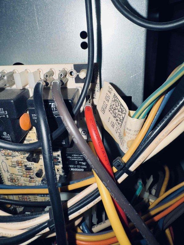 Responded to service call for 10-year-old air conditioning system not cooling correctly. Upon arrival, confirmed customer understanding of diagnostic service charge for non-operational equipment. Performed comprehensive system inspection and diagnostics using digital multimeter to test electrical components and control board functionality. Measured voltage readings at control panel, recording 398.7 volts during testing sequence. Inspected internal wiring connections, terminal blocks, and circuit board within the control enclosure. Evaluated all electrical connections including multiple wire runs and control circuits. Documented system conditions with photos of control panel interior and diagnostic meter readings for service records.