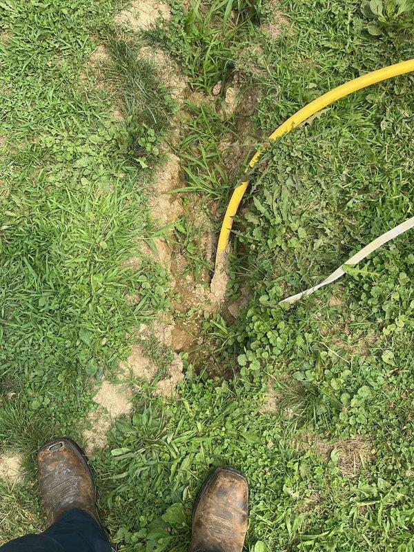 Installed new gas line from main residence to pool and barn area to replace previously severed line. Trenched and ran new gas piping underground across property, connecting to existing gas supply at the home. Installed appropriate shutoff valves and flexible connectors at termination points, ensuring proper support and mounting of exposed pipe sections at structure connections.