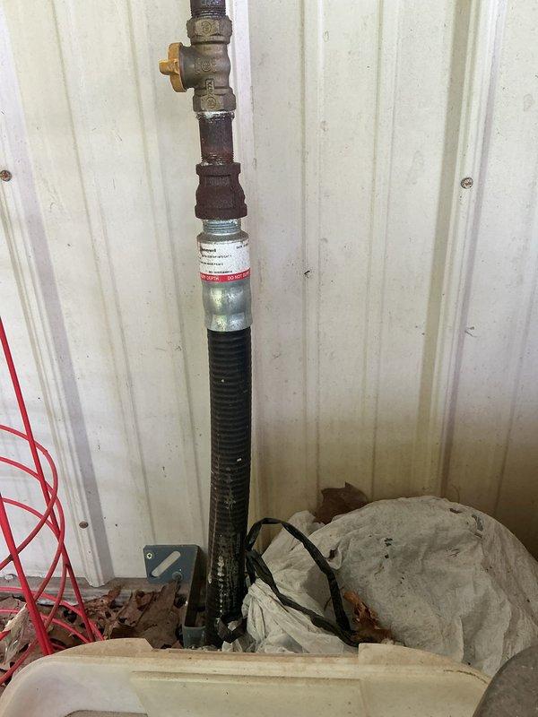 Installed new gas line from main residence to pool and barn area to replace previously severed line. Trenched and ran new gas piping underground across property, connecting to existing gas supply at the home. Installed appropriate shutoff valves and flexible connectors at termination points, ensuring proper support and mounting of exposed pipe sections at structure connections.