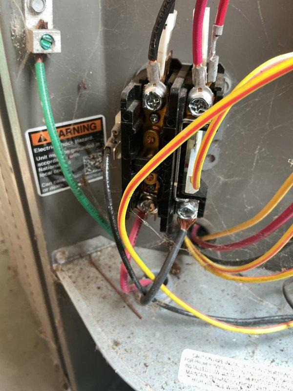 Completed routine maintenance visit on a 6-year-old air conditioning system. Inspected electrical disconnect box mounted on exterior wall, confirming proper operation and secure conduit connections. Evaluated interior electrical compartment, examining contactor assembly, wire connections, and terminal conditions; noted age-appropriate wear and minor oxidation on components but found all connections secure and functional.