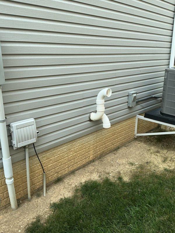 Conducted comprehensive site assessment for tankless gas water heater installation at residential property. Evaluated existing conventional tank water heater in basement utility area and exterior wall penetration requirements for venting and gas line routing. Documented current mechanical room configuration, available clearances, and utility connections to provide accurate quote for tankless unit conversion including necessary venting modifications and code-compliant installation specifications.