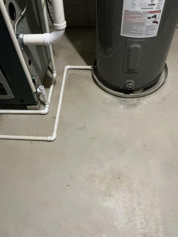 Conducted comprehensive site assessment for tankless gas water heater installation at residential property. Evaluated existing conventional tank water heater in basement utility area and exterior wall penetration requirements for venting and gas line routing. Documented current mechanical room configuration, available clearances, and utility connections to provide accurate quote for tankless unit conversion including necessary venting modifications and code-compliant installation specifications.