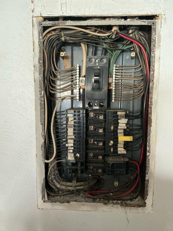 Conducted electrical estimate for installation of new exterior outlets in front yard area. Assessed existing electrical panel capacity and breaker configuration to determine feasibility of adding dedicated exterior circuits. Documented current panel conditions including available breaker spaces and wire routing for proposed outdoor receptacle installation.