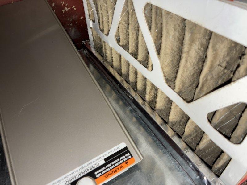 Responded to service call for air conditioning system not cooling adequately and outdoor unit producing loud buzzing noise. Upon arrival, performed diagnostic inspection of both indoor and outdoor components. Inspected control board and electrical connections at air handler, verifying all wiring terminations and control circuits. Noted heavily soiled air filter restricting airflow through system. Due to advanced age of equipment and operational issues present, advised customer that unit has reached end of service life and replacement would be most cost-effective solution rather than repair.