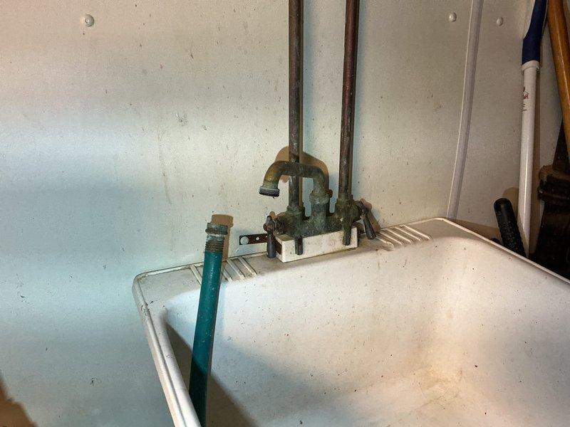 Responded to service call for leaking faucets in basement utility sink and bathroom. Upon inspection, identified deteriorated supply line connections and corroded shut-off valves contributing to water seepage at both locations. Replaced worn flexible braided supply lines, installed new P-trap assembly with proper threaded connections, and secured all fittings to eliminate leaks. Tested water flow and verified all connections were watertight with no active dripping from faucets or drain assemblies.