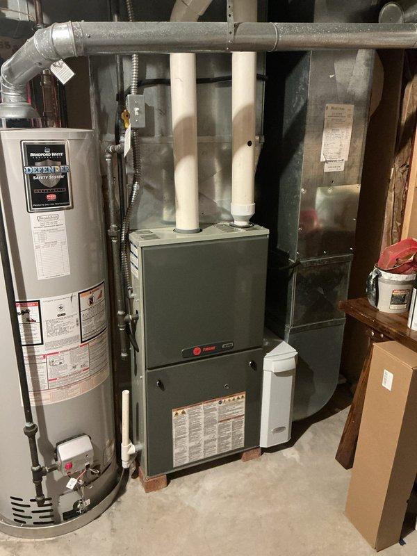 Completed MVP cooling maintenance visit on 13-year-old Trane HVAC system. Performed comprehensive inspection of outdoor condenser unit and indoor furnace components, verified proper operation of all system components, checked refrigerant lines and electrical connections, and documented equipment condition through photographic records. All components found operating within normal parameters with no immediate service needs identified.