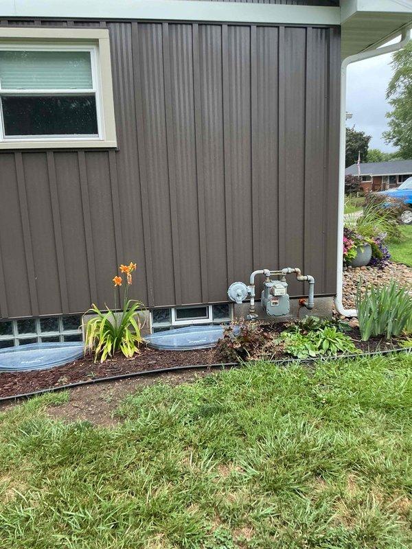 Conducted comprehensive site assessment for Generac generator installation at residential property. Evaluated exterior utility meter location and electrical service entry point on building exterior, documented existing gas line infrastructure and clearance requirements from building openings and landscaping features. Inspected basement electrical panel location and available routing paths through unfinished basement space, assessed ceiling joist configuration and existing conduit pathways for transfer switch installation and generator circuit integration. Documented suitable mounting locations considering foundation vents, utility connections, and setback requirements for code compliance. Provided detailed photographic documentation of service entrance equipment, basement infrastructure, and proposed installation area to support accurate material takeoff and labor estimation for automatic standby generator system.