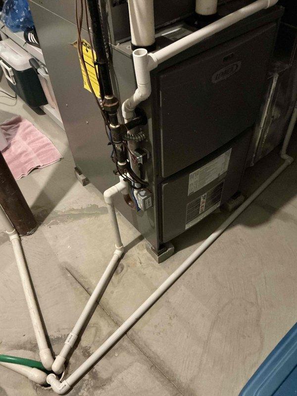 Conducted comprehensive estimate for furnace and air conditioning system replacement at residential property. Customer reported unusually high utility bills and history of multiple refrigerant recharges by previous service provider. Evaluated existing Carrier furnace installation and associated air conditioning system, documenting current equipment configuration including PVC venting, electrical connections, and ductwork integration. Assessed system performance concerns and provided replacement options to address ongoing efficiency issues and repeated refrigerant loss indicating potential system failure.