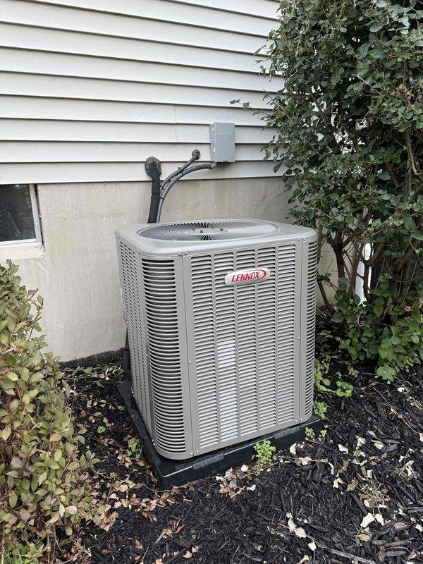 Completed comprehensive AC tune-up on a two-year-old Lennox split system. Performed standard preventative maintenance including inspection of outdoor condenser unit, verified proper operation of all components, checked refrigerant levels, cleaned coils, and tested system performance. Indoor furnace and air handler located in basement showed normal operation with proper airflow through ductwork. All electrical connections secure, disconnect box functioning properly, and unit operating within manufacturer specifications. System running efficiently with no issues identified.