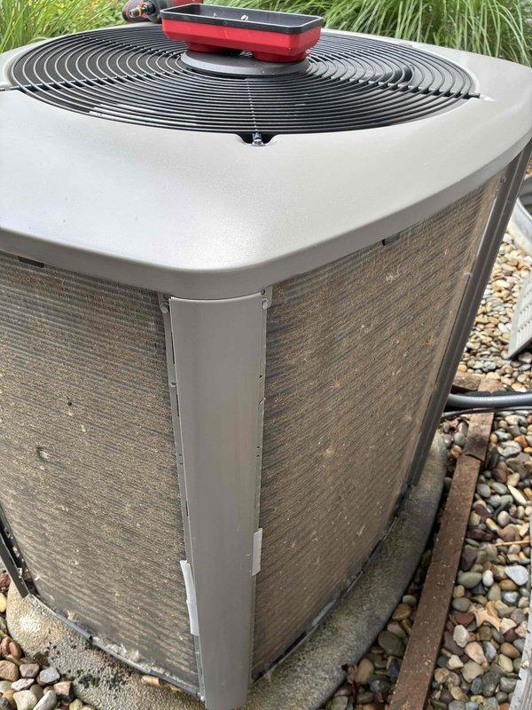 Completed comprehensive air conditioning tune-up on 8-year-old outdoor condenser unit. Renewed maintenance value plan with technician coverage for future service visits. Unit inspected and found to be in good operational condition with normal weathering consistent with age and outdoor installation.