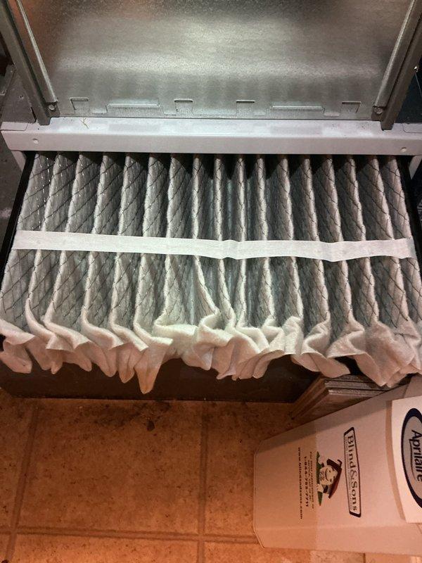 Completed routine AC maintenance inspection on three-year-old Lennox HVAC system. Inspected air filter showing moderate dust accumulation with heavier loading in upper sections; filter still within serviceable condition but recommended monitoring for replacement at next service interval. Verified proper installation of system components, checked PVC condensate drainage lines and connections, and confirmed all manufacturer labels and service documentation were intact. System operating within normal parameters with no deficiencies noted at time of inspection.