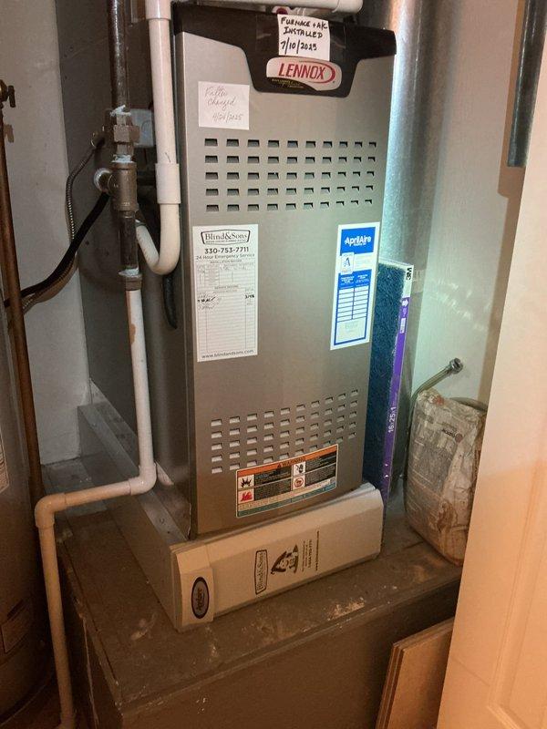 Completed routine AC maintenance inspection on three-year-old Lennox HVAC system. Inspected air filter showing moderate dust accumulation with heavier loading in upper sections; filter still within serviceable condition but recommended monitoring for replacement at next service interval. Verified proper installation of system components, checked PVC condensate drainage lines and connections, and confirmed all manufacturer labels and service documentation were intact. System operating within normal parameters with no deficiencies noted at time of inspection.