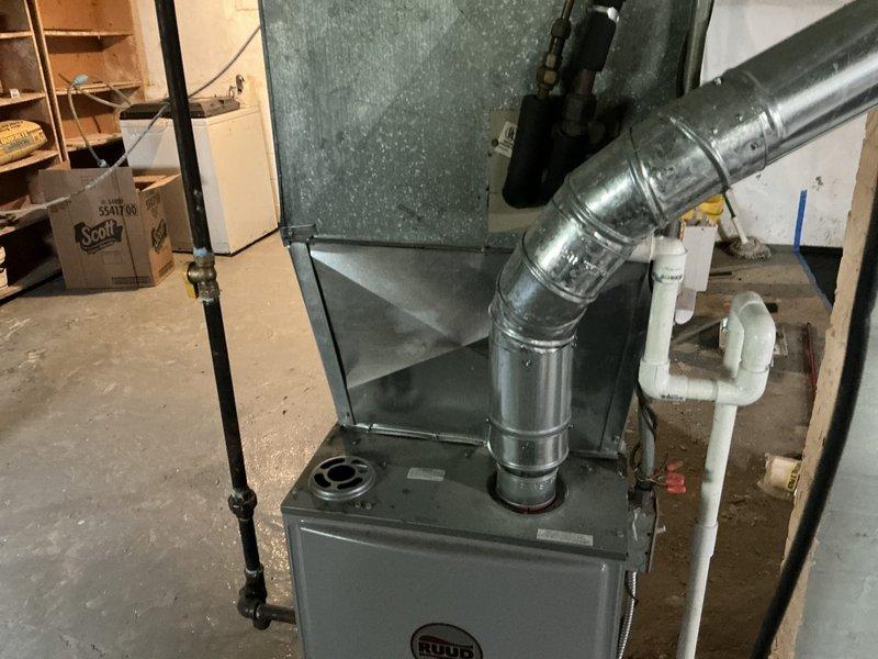 Responded to no cooling complaint on 26-year-old HVAC system and diagnosed failed compressor. Provided comprehensive replacement estimate for aging unit that is beyond economical repair. Documented existing Ruud furnace installation and current system configuration with photos for customer records and replacement planning purposes.